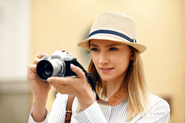 istock Woman Taking Photos On Camera On Street 959626850