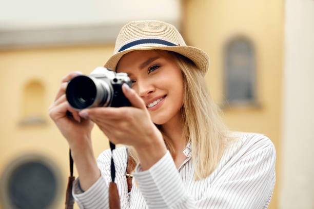 istock Woman Taking Photos On Camera On Street 959626902