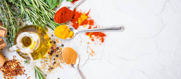 istock Olive oil bottle with spices and herbs.Top view 959633272