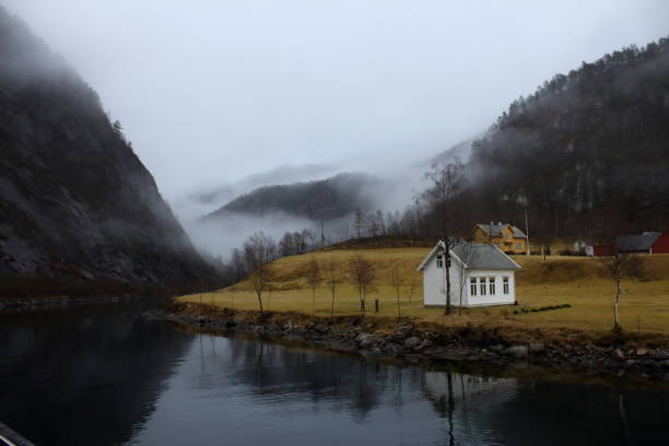 istock Small white house on a remote fjords 959633552