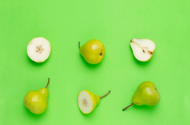 istock Pears on green background.Fresh and healthy fruits. 959633580