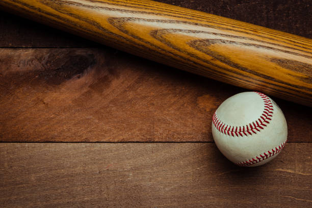 istock Vintage baseball gear on a wooden background 959635412