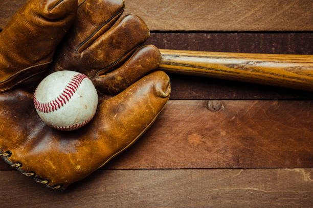 istock Vintage baseball gear on a wooden background 959635962