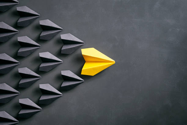 istock Paper airplane on blackboard - Origami Yellow Concept 959639296
