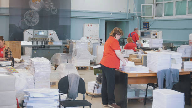 The room with working people in action in the typography