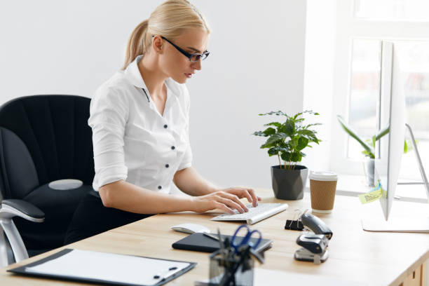 istock Business People. Woman Working On Computer In Office 959641818