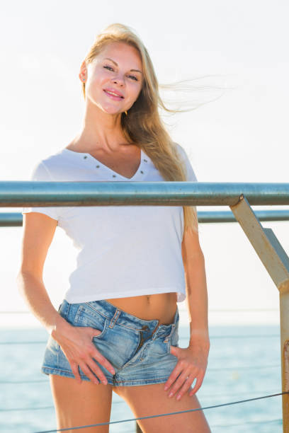 istock Elegant woman is posing on pirce in her free time 959642482