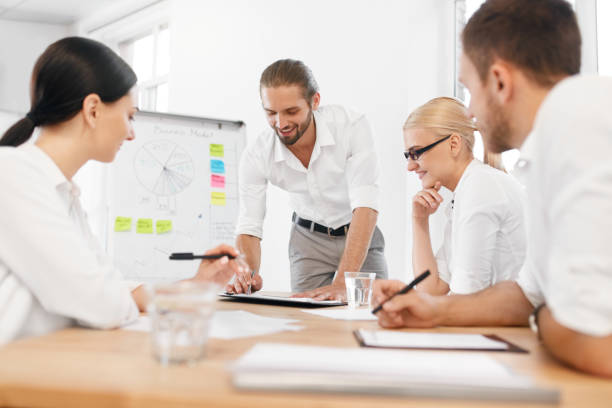 istock Team Meeting. Business Training With Employees In Office. 959642896