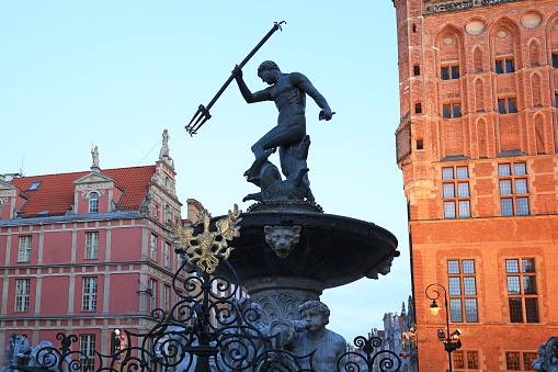 Fountain of the Neptune in old town of Gdansk at dawn, Poland
