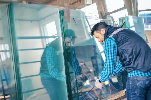 istock Worker handling glass sheet in warehouse 959646482