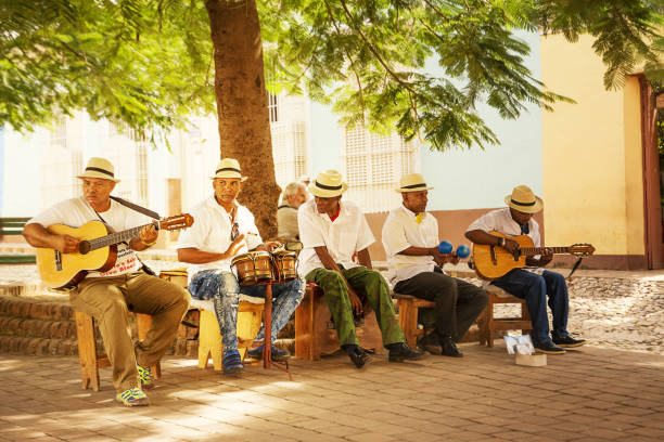 Musical group that plays Cuban music in the square Trinidad, Cuba - 8 december 2017: Musical group that plays Cuban music in the square trinidad culture stock pictures, royalty-free photos & images