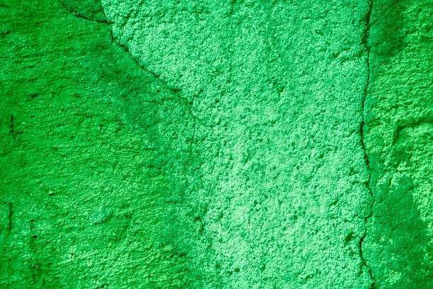istock Ultra green Plaster concrete texture, stone surface, rock cracked background for postcard 959651258