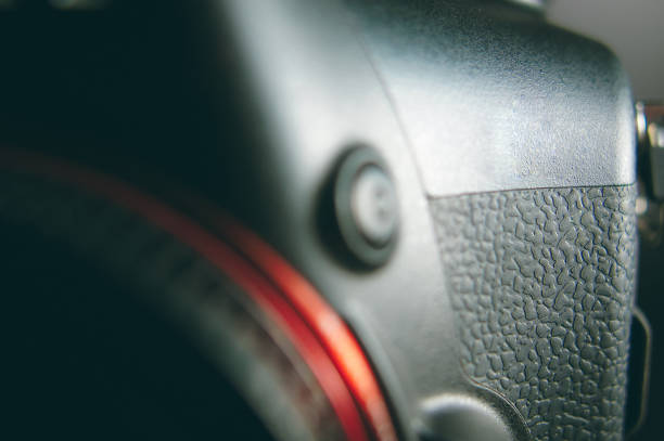 istock Professional modern DSLR camera low key image - Modern DSLR camera with a very wide aperture lens 959651434