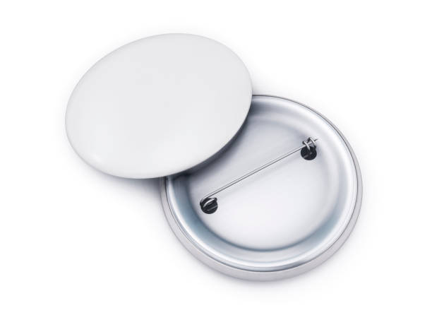 istock White badge pin brooch front and back side isolated on white background. Empty clear pin emblem mock up. Template button badge  mock-up for your design. 3d rendering. 959654614