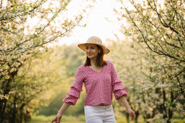 istock Beautiful woman in the orchard 959654714