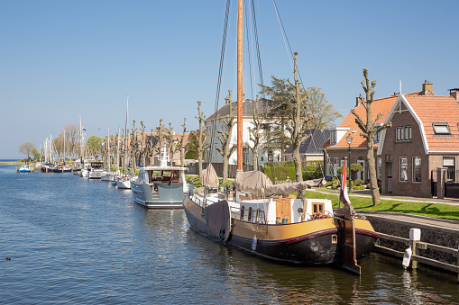 Harbor Dutch city Medemblik with old historical wooden sailing ship
