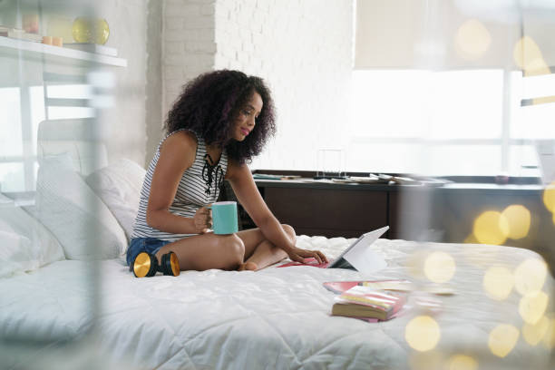 istock Beautiful Hispanic Woman Studying At Home With Laptop Pc 959658876