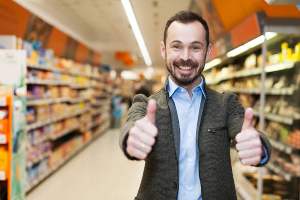 istock smiling man who is satisfied shopping 959662398
