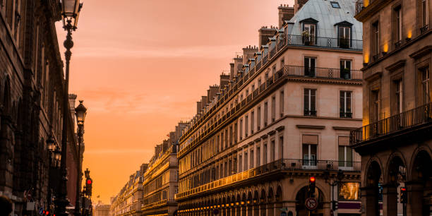 istock Sunset in Paris, street with its building in corridor 959666048