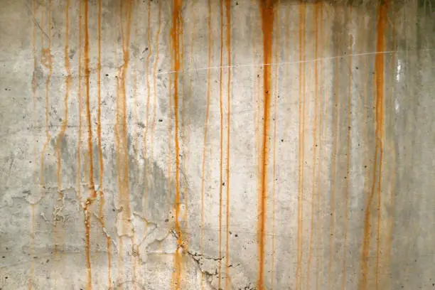 Photo of Rust stains on the cement wall