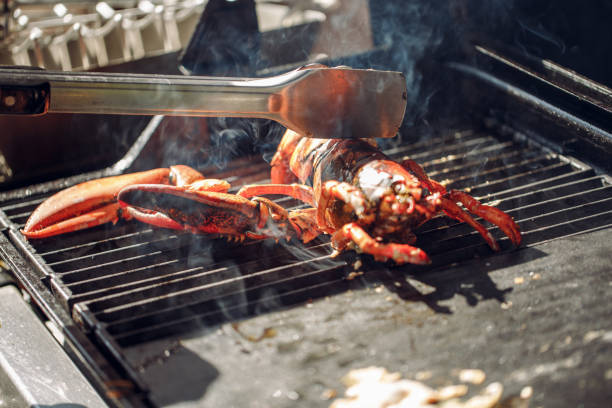 istock Lobster grilled barbecued seafood in BBQ Flames. 959670820
