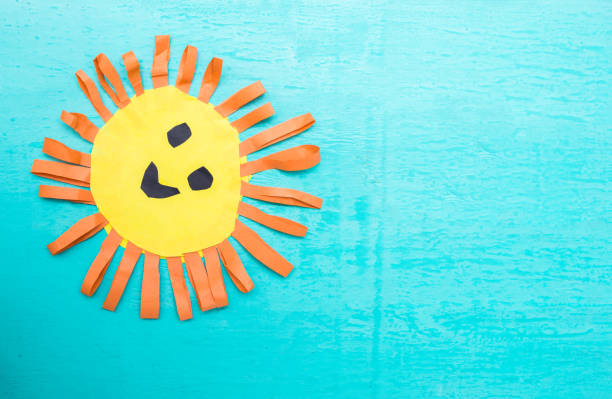 istock Children's handmade from colored paper - the sun with a smile 959673166