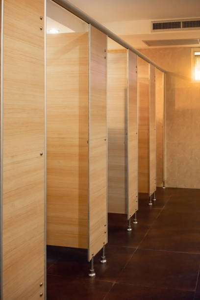 istock Clean public toilet room empty with big window and light from outside, restroom interior. 959673304