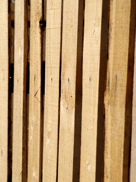 istock temporary wooden fence made from raw boards 959673334