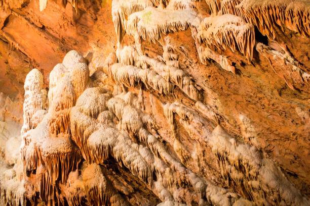 istock Big Cavern with colorful and textured mineral deposits 959674904