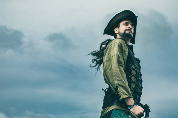 Pirate standing in front of the storm. Fantasy stock photo