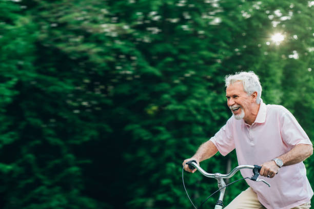 istock Happy senior man cycling. 959682716