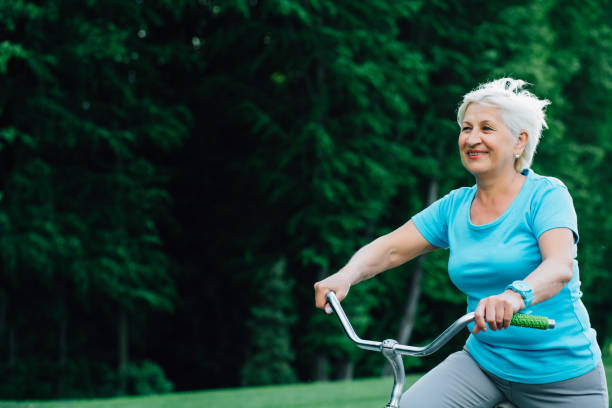 istock Happy senior woman cycling. 959682732