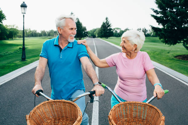 istock senior couple going for a bicycle ride in the park 959682750