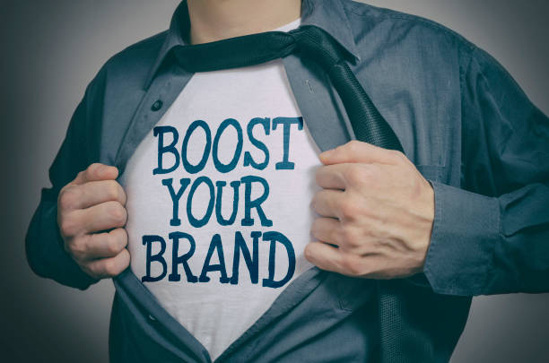Boost Your Brand Man showing Boost Your Brand tittle on t-shirt high fidelity stock pictures, royalty-free photos & images