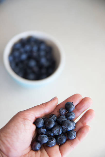 istock Woman holding blueberries 959688656
