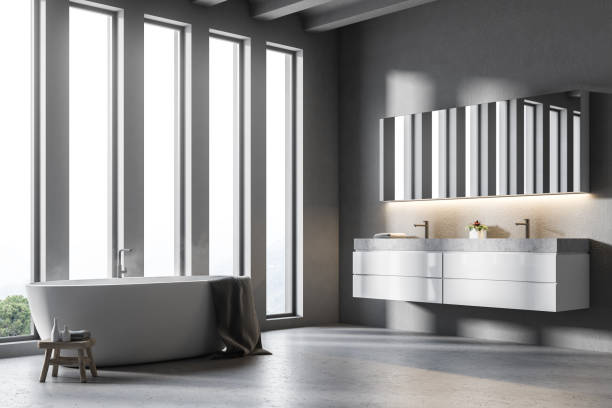 istock Double sink gray bathroom with bathtub side view 959690362