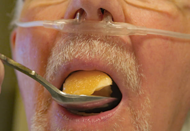 istock Close-up of senior man's face with oxygen cannula 959692712