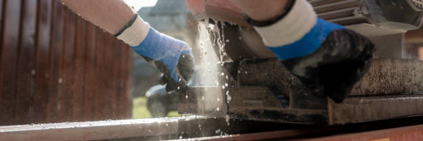 istock Low angle view of an angle grinder or circular saw cutting a concrete block 959693010