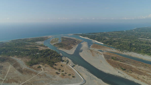 istock River flowing into the sea 959694772