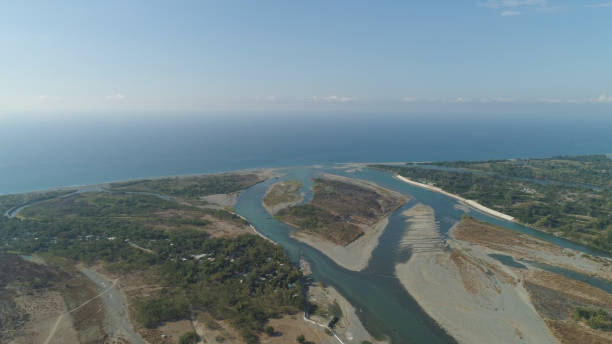 istock River flowing into the sea 959694794