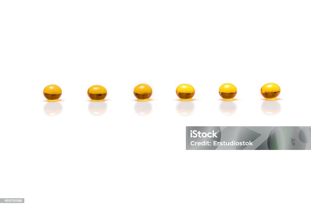 pills on the white background yellow pills isolated on the white background Addiction Stock Photo