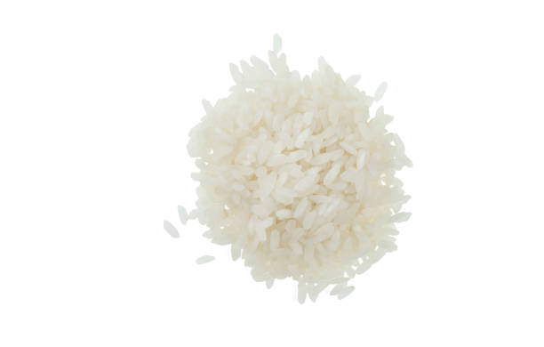 istock A handful of white rice isolated on white background 959705166