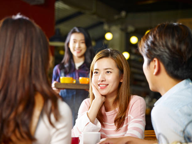 istock young adults gathering in coffee shop 959708570