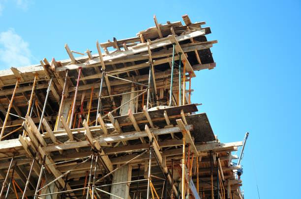 istock wooden sheeting and scaffolding at a building under construction 959712254