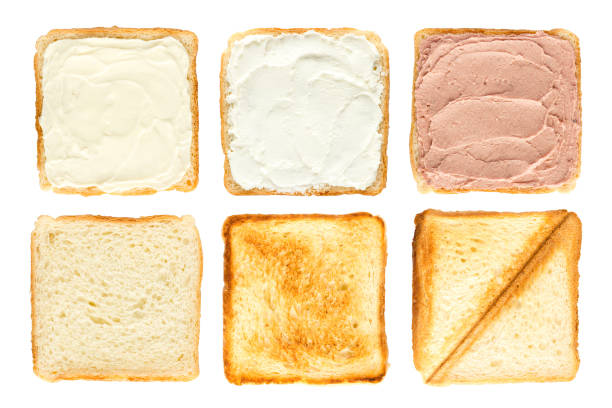 Butter spread on a peace of bread. Isolated on white.
