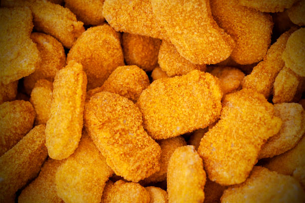 istock Frozen nuggets spread out evenly as a background. 959713354