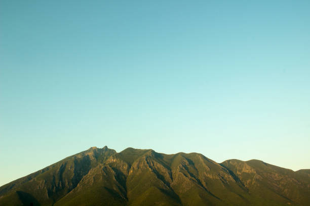 Side view of the Cerro de la Silla Mountain, in Monterrey, Nuevo Leon, Mexico. It's the most famous natural monument of the city, being its emblem since its foundation.