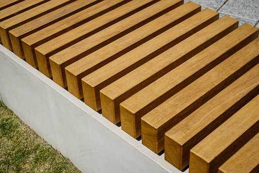 modern bench, wooden bench closeup,  urban furniture detail  -