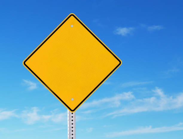 istock Blank Yellow Road Warning Information Sign Blue Sky Background 959716566