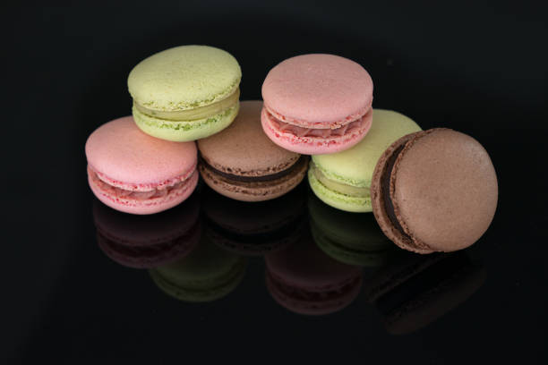 istock Colorful macaroons on balck background. 959716588